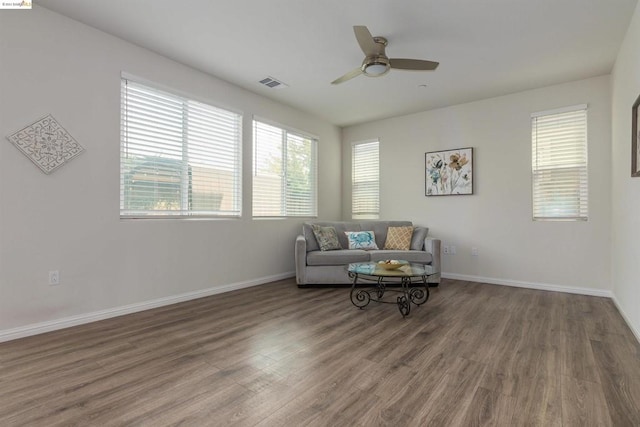 sitting room with dark hardwood / wood-style flooring and ceiling fan