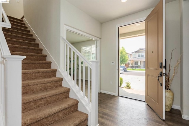 entrance foyer with hardwood / wood-style flooring and a healthy amount of sunlight