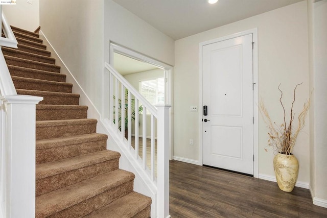 foyer entrance with dark hardwood / wood-style flooring