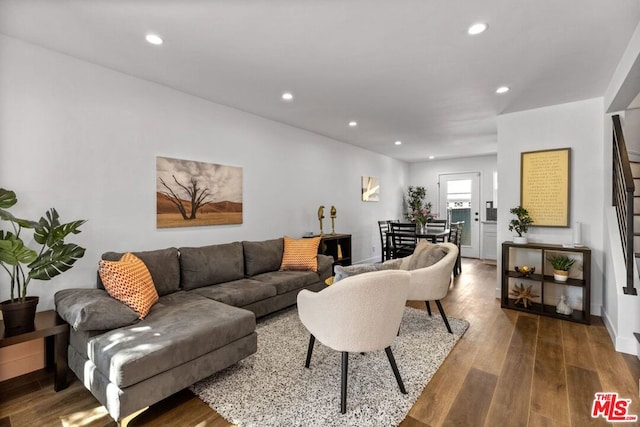 living room with dark hardwood / wood-style floors