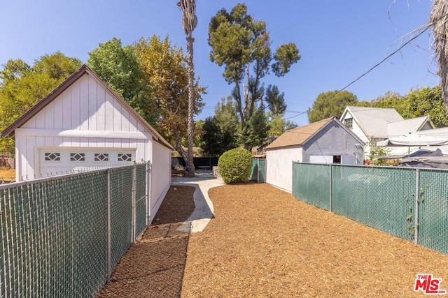 view of yard featuring a garage