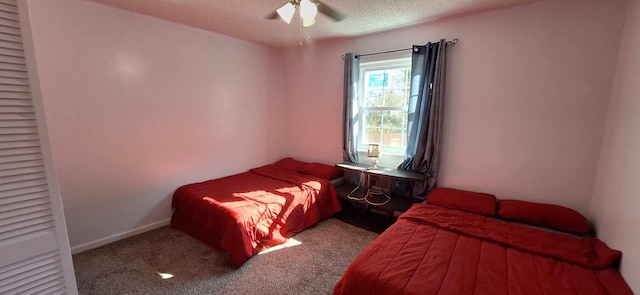 6567 NE Montrose Trl, Tallahassee, FL 32309 - carpeted bedroom with a textured ceiling, a ceiling fan, and baseboards