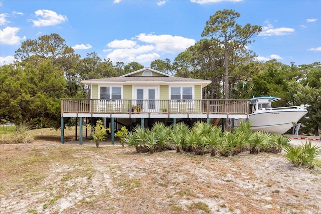 rear view of house with a wooden deck