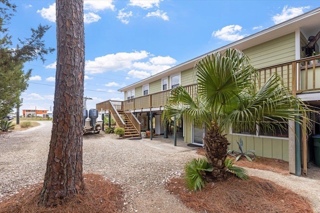 549 E Gulf Beach Dr, Saint George Islan, FL 32328 - surrounding community with stairway and a deck