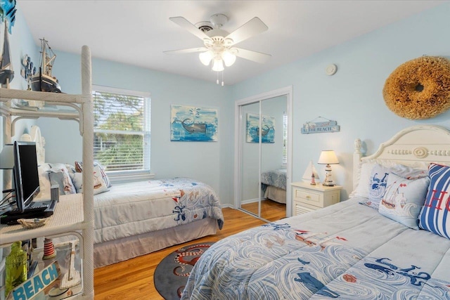 549 E Gulf Beach Dr, Saint George Islan, FL 32328 - bedroom featuring wood finished floors, a closet, and ceiling fan