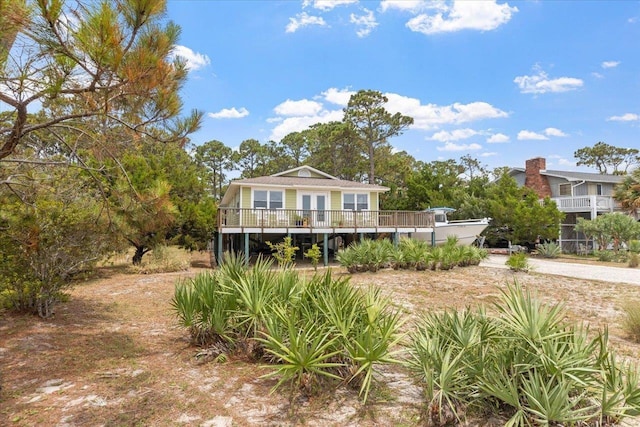 549 E Gulf Beach Dr, Saint George Islan, FL 32328 - view of front facade featuring a deck