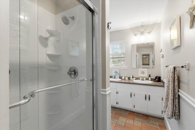 549 E Gulf Beach Dr, Saint George Islan, FL 32328 - full bathroom with a stall shower, vanity, and stone finish flooring