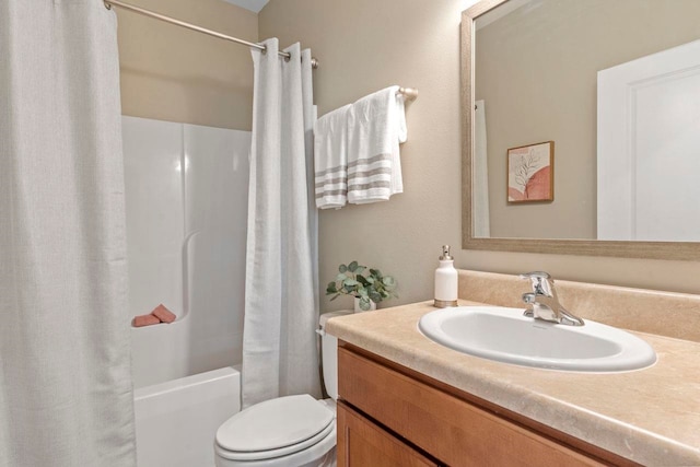 full bathroom featuring vanity, toilet, and shower / bath combination with curtain