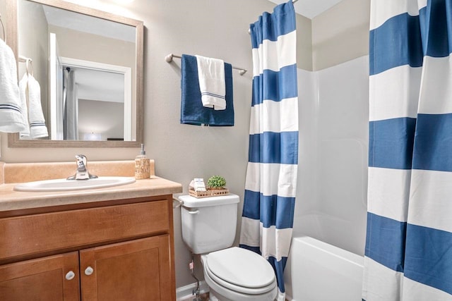 full bathroom with toilet, shower / tub combo with curtain, and vanity