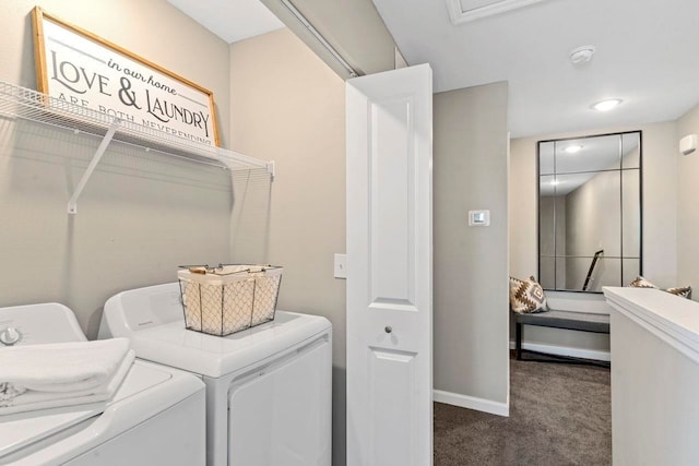 clothes washing area featuring separate washer and dryer and dark carpet