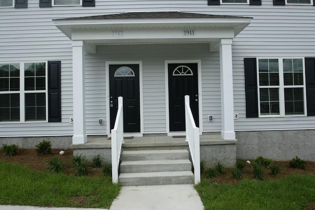 property entrance with covered porch