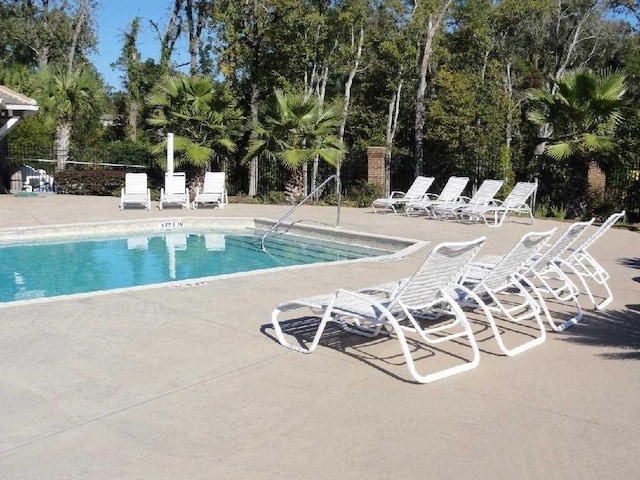 view of swimming pool with a patio