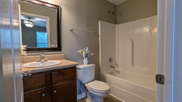 full bathroom featuring ceiling fan, tile patterned floors, toilet, vanity, and bathtub / shower combination