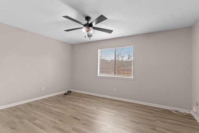 empty room featuring light hardwood / wood-style flooring and ceiling fan