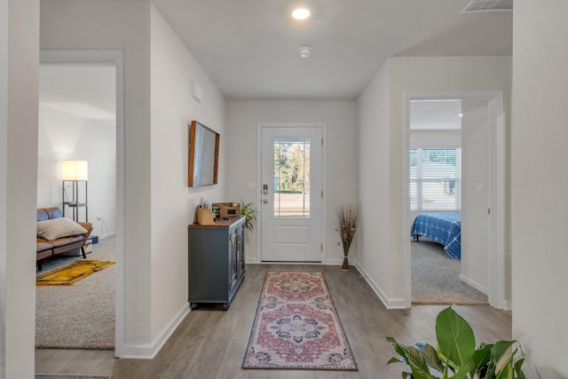 entryway with light hardwood / wood-style floors