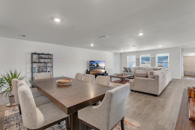 dining space with light wood-type flooring