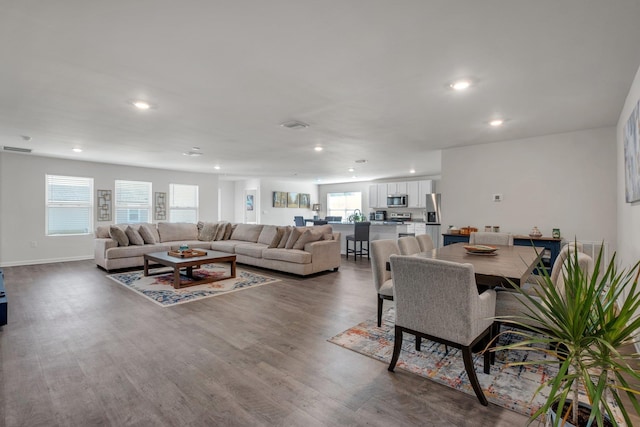 living room featuring plenty of natural light and hardwood / wood-style floors