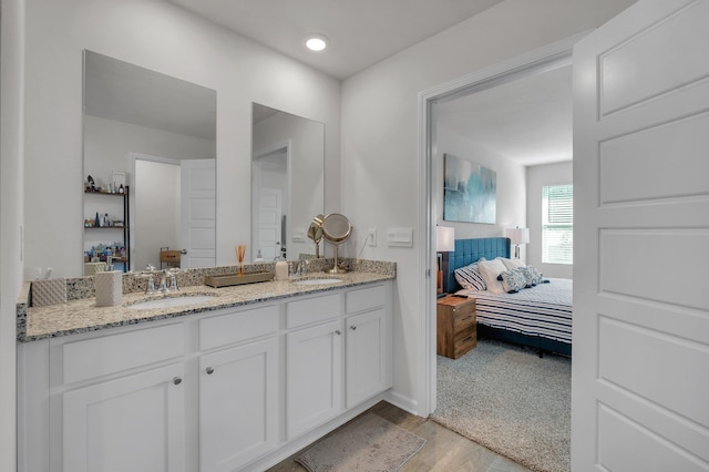 bathroom with vanity and hardwood / wood-style floors