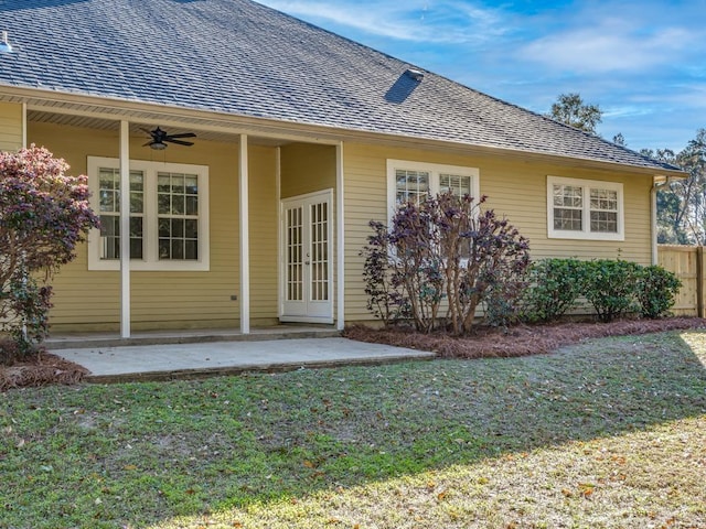 back of house featuring ceiling fan, a yard, and a patio