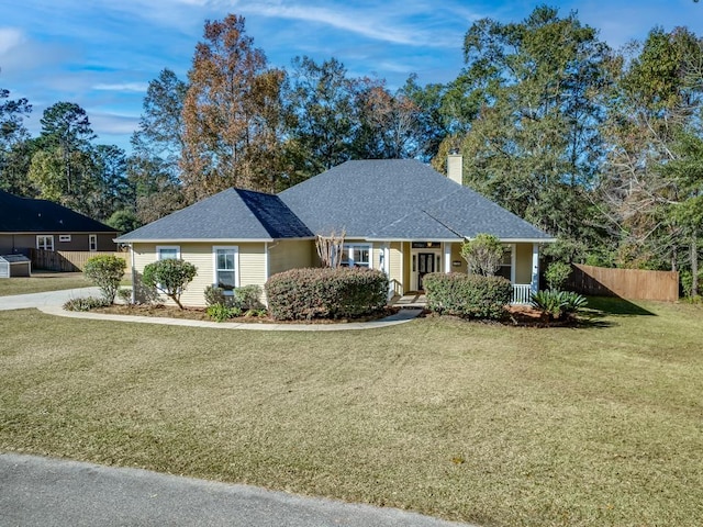 ranch-style house featuring a porch and a front yard