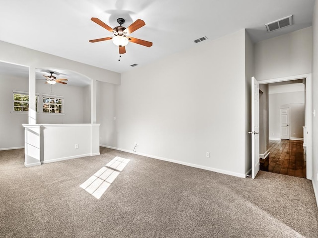 empty room with carpet flooring and ceiling fan