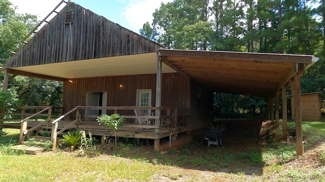 rear view of house featuring a carport