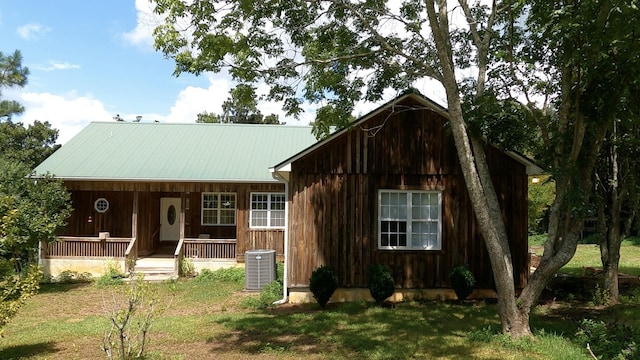 view of front facade featuring central air condition unit and covered porch