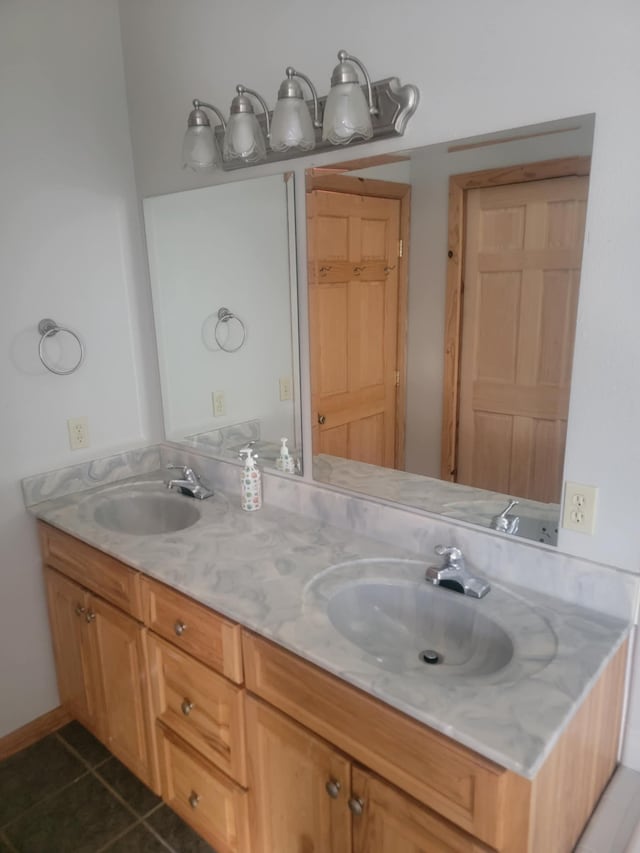 bathroom featuring tile patterned flooring and vanity
