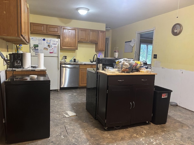 1208 Halifax Ct, Tallahassee, FL 32308 - kitchen featuring dishwasher, freestanding refrigerator, a center island, and light countertops