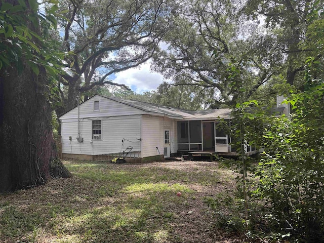 1208 Halifax Ct, Tallahassee, FL 32308 - back of house with a sunroom