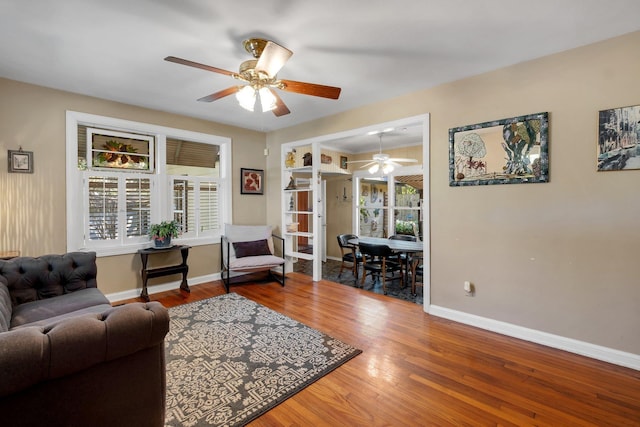 living room featuring ceiling fan, a healthy amount of sunlight, and hardwood / wood-style flooring