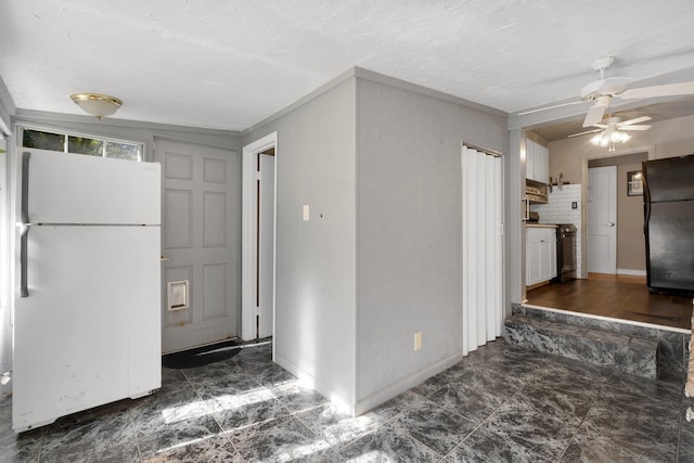 kitchen with stainless steel range oven, white refrigerator, decorative backsplash, black fridge, and ceiling fan