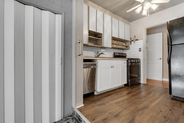 kitchen with white cabinetry, ceiling fan, appliances with stainless steel finishes, tasteful backsplash, and dark hardwood / wood-style flooring