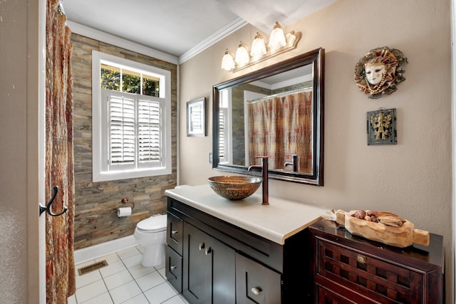 bathroom featuring toilet, vanity, ornamental molding, and tile patterned flooring