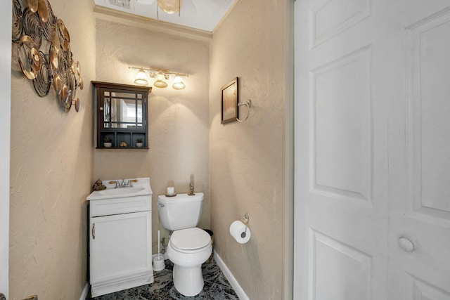 bathroom featuring toilet and vanity