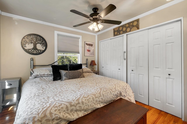 bedroom featuring ceiling fan, wood-type flooring, and ornamental molding