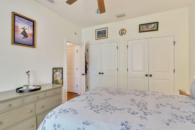 bedroom with two closets and ceiling fan