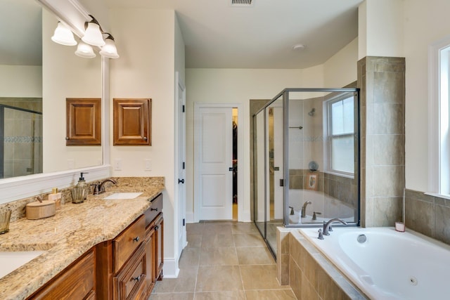 bathroom featuring vanity, tile patterned floors, and plus walk in shower