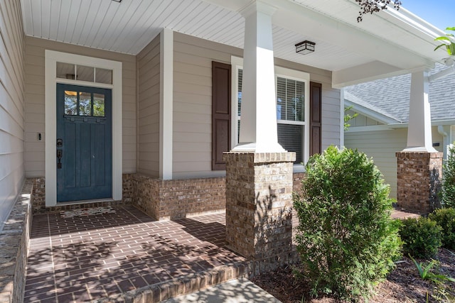 doorway to property with a porch