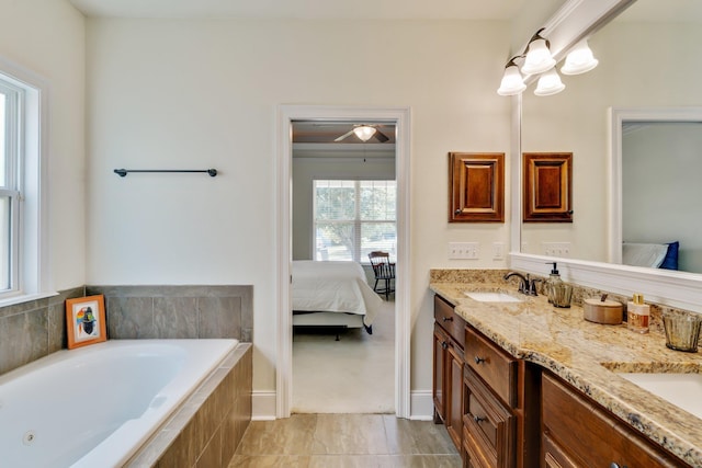 bathroom with vanity and a relaxing tiled tub