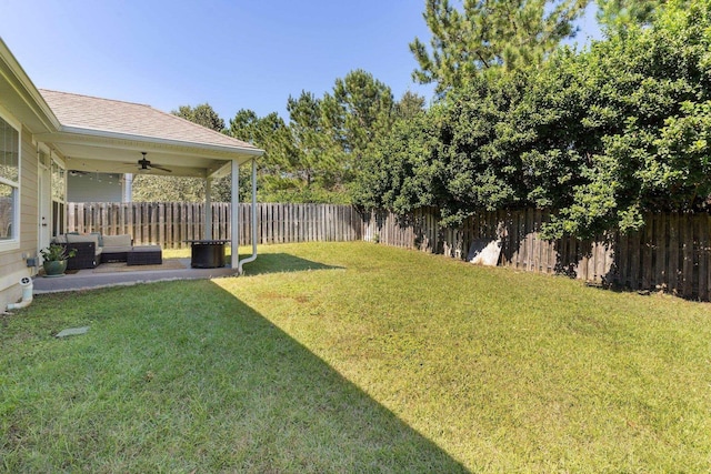 view of yard with ceiling fan