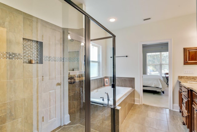 bathroom with tile patterned floors, shower with separate bathtub, and vanity