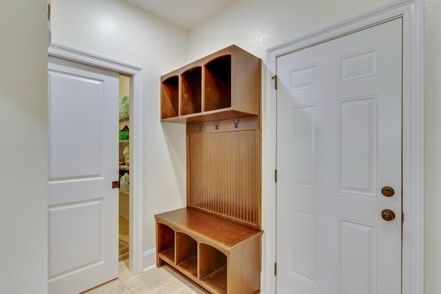 mudroom with light tile patterned flooring