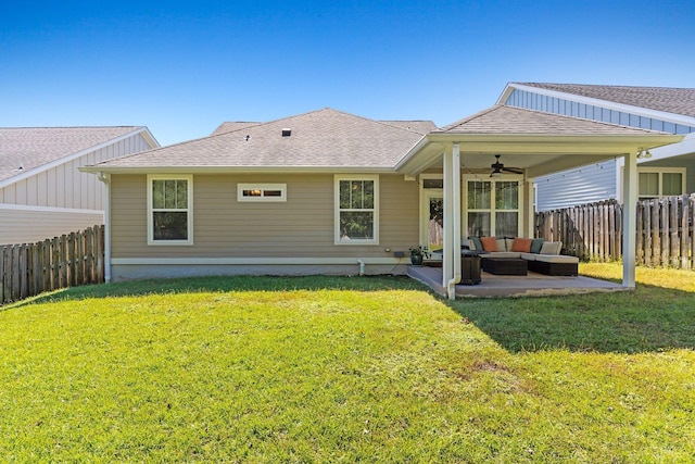 back of property with a lawn, outdoor lounge area, a patio, and ceiling fan