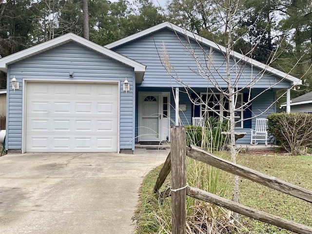 view of front of house with a garage and a porch