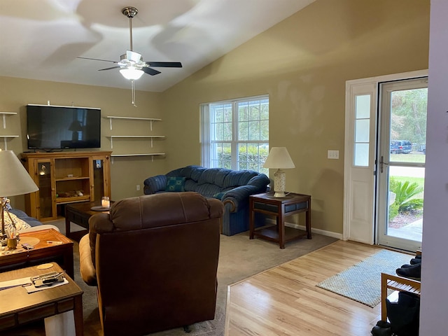 living room with vaulted ceiling, ceiling fan, and wood-type flooring