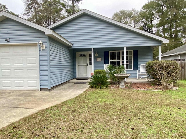 single story home featuring covered porch, a garage, and a front yard