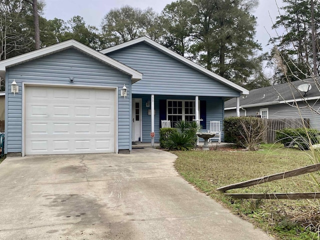 ranch-style home featuring a garage, a front yard, and a porch