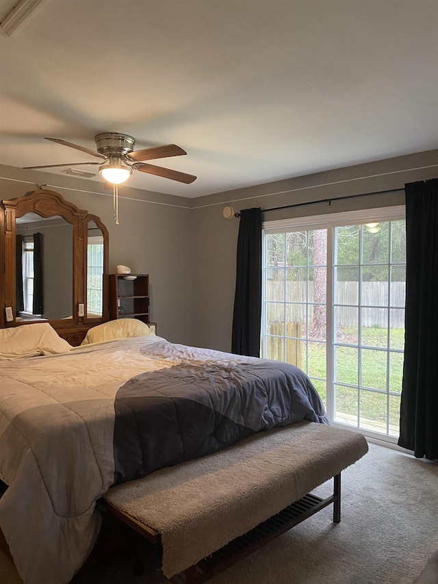 bedroom featuring carpet, ceiling fan, and access to exterior