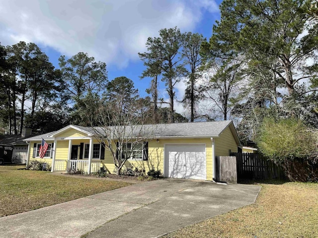 ranch-style house with a garage, a front lawn, and covered porch